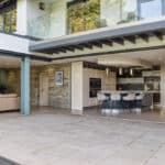 Thumbnail of http://Modern%20open-plan%20kitchen%20and%20living%20area%20with%20sliding%20glass%20doors%20to%20a%20spacious%20patio.