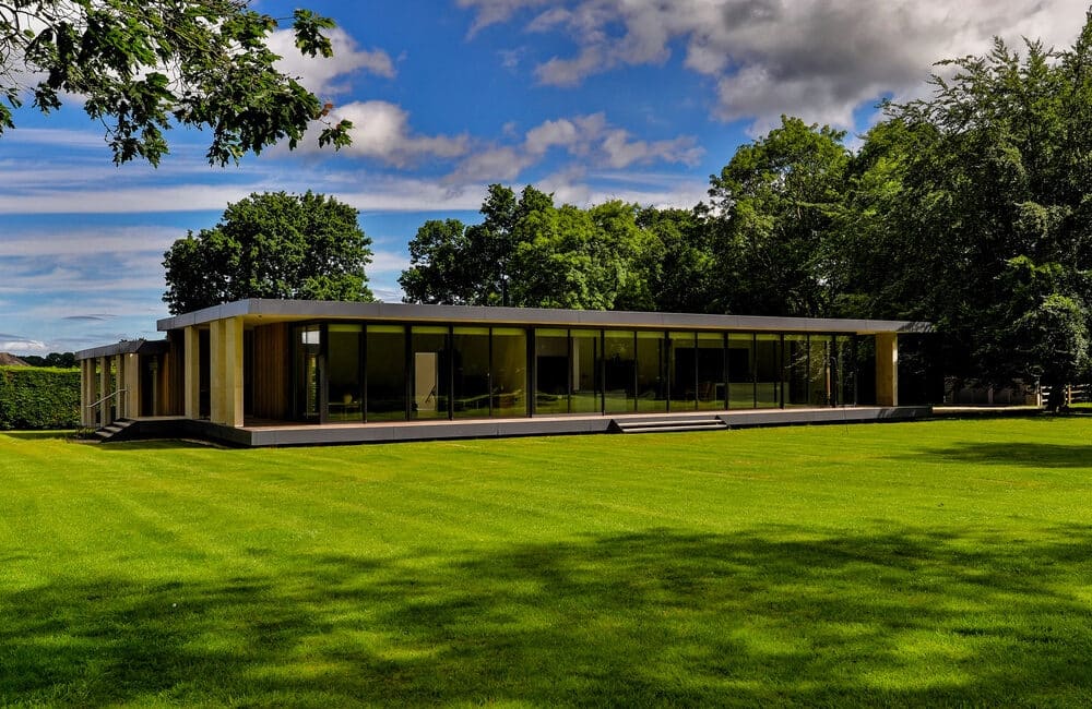 Glass-fronted new build home in Area of Outstanding Natural Beauty